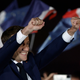 French President Emmanuel Macron gestures on stage.